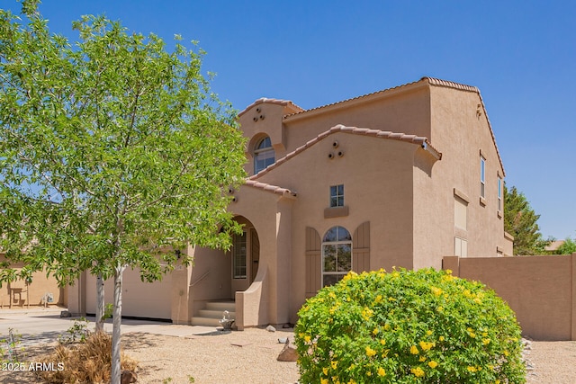 3381 E Canary Way, Chandler, AZ 85286 - mediterranean / spanish home featuring stucco siding, driveway, a tile roof, and fence