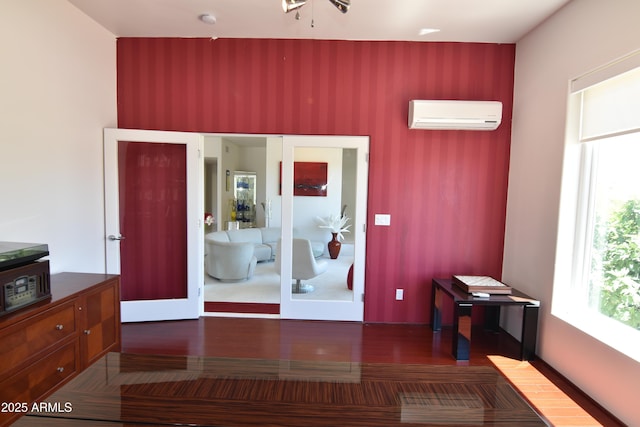 2570 E Manzanita St, Apache Junction, AZ 85119 - bedroom featuring an AC wall unit, multiple windows, and wood finished floors