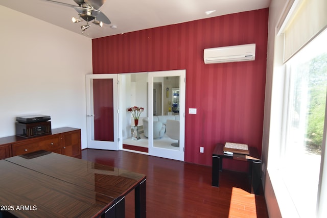 2570 E Manzanita St, Apache Junction, AZ 85119 - bedroom with a wall mounted AC and dark wood finished floors