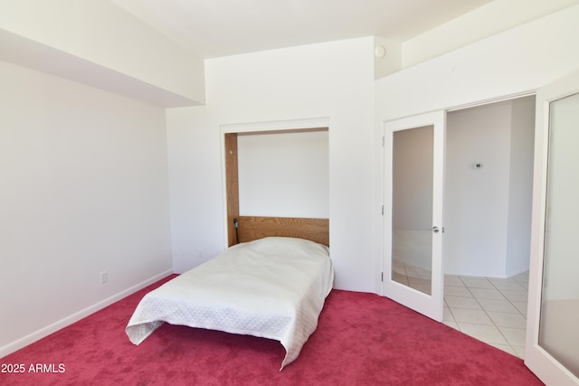 2570 E Manzanita St, Apache Junction, AZ 85119 - carpeted bedroom featuring french doors and tile patterned floors