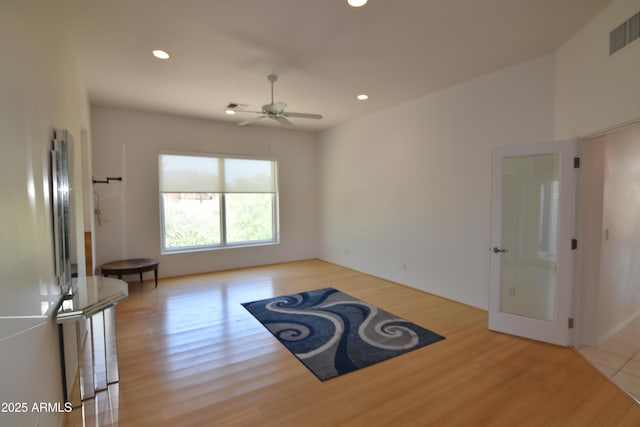 2570 E Manzanita St, Apache Junction, AZ 85119 - unfurnished living room with light wood-type flooring, a ceiling fan, and recessed lighting