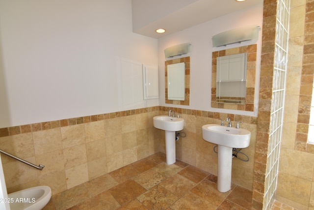 2570 E Manzanita St, Apache Junction, AZ 85119 - bathroom featuring tile walls, a sink, a bidet, and recessed lighting