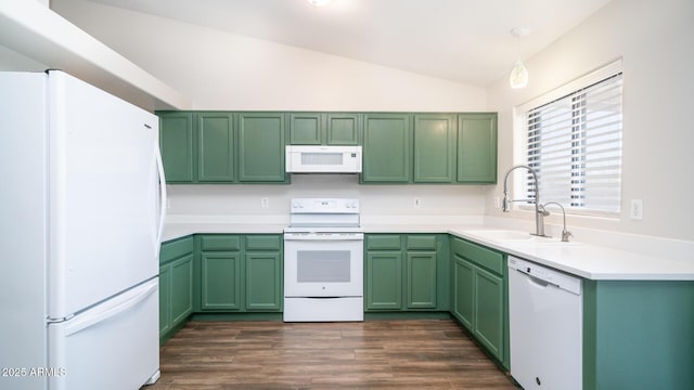 kitchen with sink, decorative light fixtures, green cabinets, lofted ceiling, and white appliances