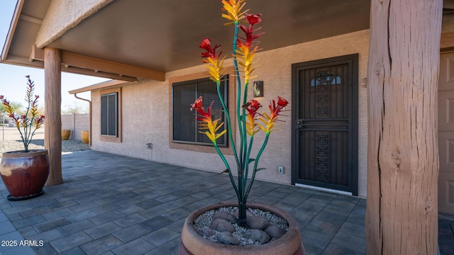 doorway to property with a patio area