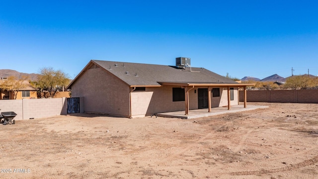 rear view of property with a patio and central AC unit