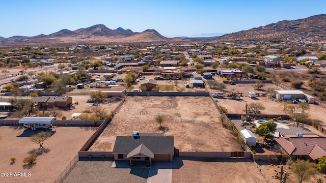 birds eye view of property with a mountain view