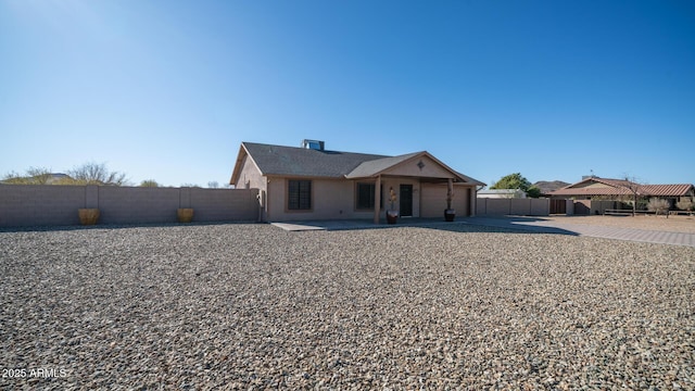 ranch-style home featuring a patio area