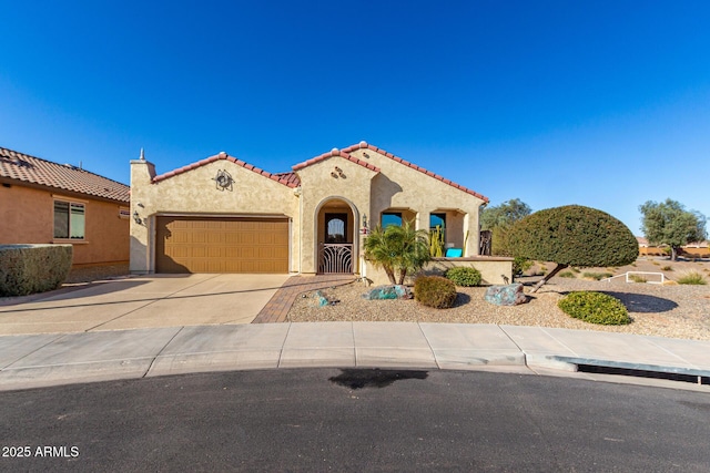 mediterranean / spanish house with a garage