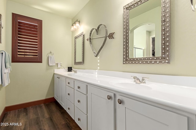 bathroom with vanity and hardwood / wood-style flooring