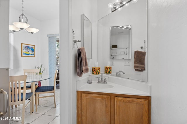 bathroom with tile patterned flooring and vanity