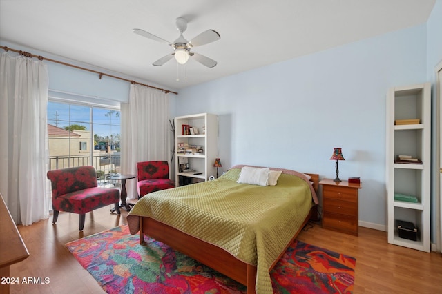 bedroom featuring light hardwood / wood-style flooring and ceiling fan