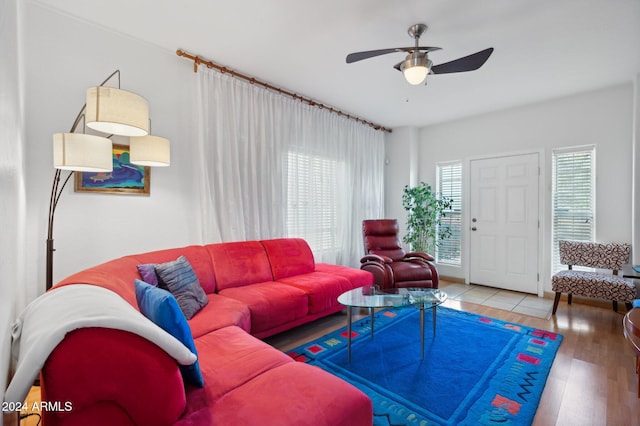 living room with hardwood / wood-style floors and ceiling fan