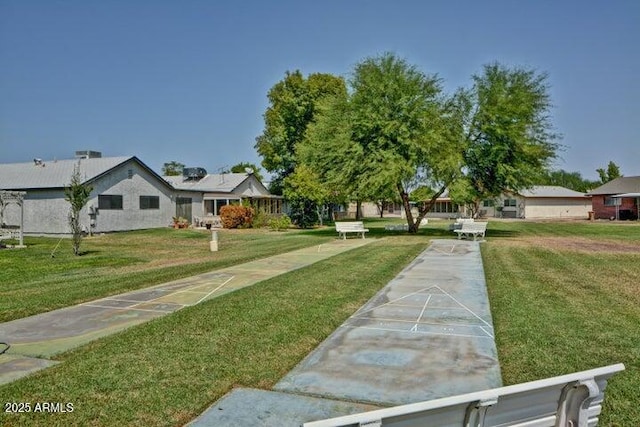 view of yard with shuffleboard