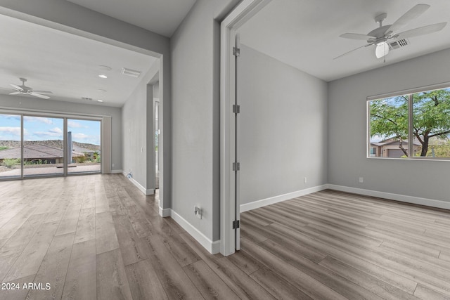 hall with light hardwood / wood-style floors