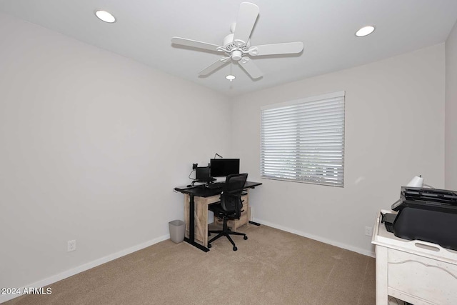 office with light carpet and ceiling fan