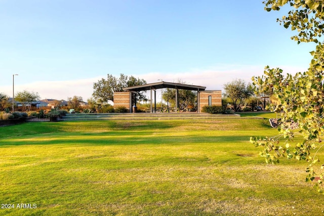 view of home's community with a yard