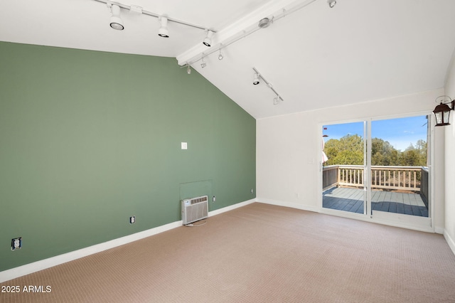 interior space featuring baseboards, lofted ceiling, and carpet
