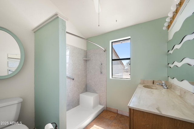 full bath featuring toilet, a shower, vanity, and tile patterned floors