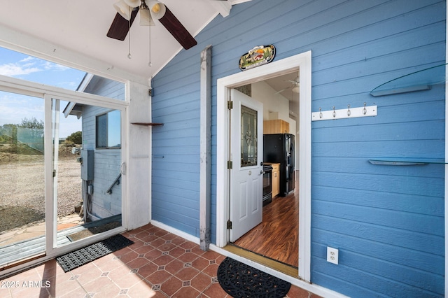 entrance to property with ceiling fan