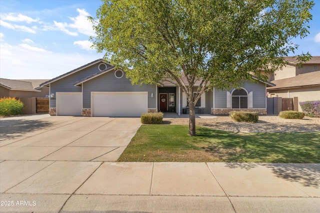 20464 E Bronco Dr, Queen Creek, AZ 85142 - view of front of property with stone siding, a garage, and driveway