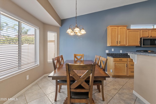 20464 E Bronco Dr, Queen Creek, AZ 85142 - dining room with lofted ceiling, light tile patterned floors, and a chandelier