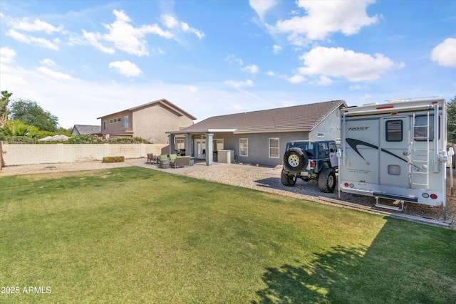 20464 E Bronco Dr, Queen Creek, AZ 85142 - back of house featuring a patio, stucco siding, and an outdoor hangout area