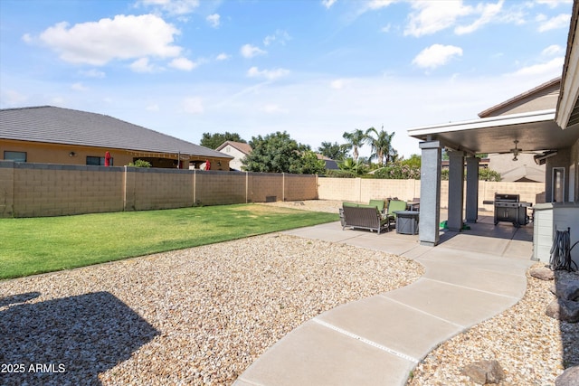20464 E Bronco Dr, Queen Creek, AZ 85142 - fenced backyard with ceiling fan and a patio area