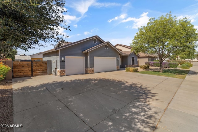 20464 E Bronco Dr, Queen Creek, AZ 85142 - single story home featuring an attached garage, driveway, stone siding, and a gate