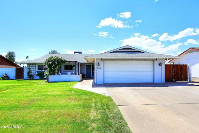 5634 N 39th Ave, Phoenix, AZ 85019 - ranch-style house with a front lawn, fence, roof with shingles, concrete driveway, and an attached garage