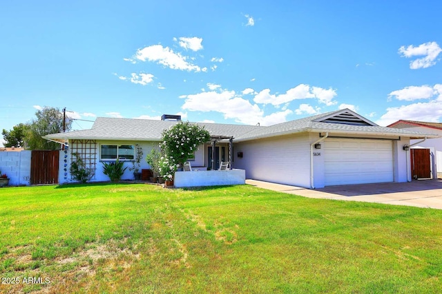 5634 N 39th Ave, Phoenix, AZ 85019 - ranch-style house with a garage, a front lawn, fence, and driveway