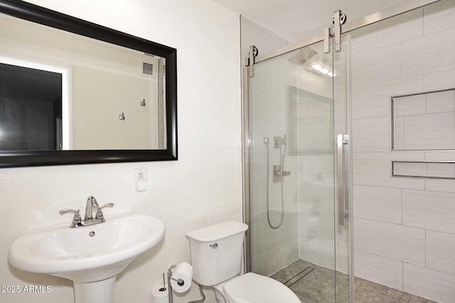 5634 N 39th Ave, Phoenix, AZ 85019 - full bathroom with toilet, visible vents, a shower stall, and a sink