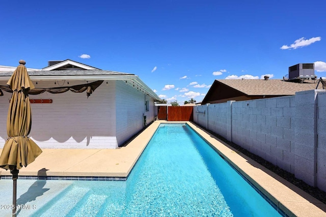 5634 N 39th Ave, Phoenix, AZ 85019 - view of pool featuring a fenced in pool, a fenced backyard, and central air condition unit
