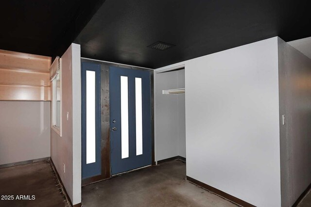 5634 N 39th Ave, Phoenix, AZ 85019 - entryway with baseboards and unfinished concrete flooring