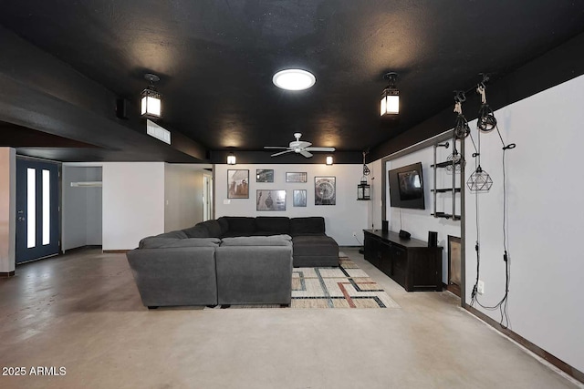 5634 N 39th Ave, Phoenix, AZ 85019 - home theater with concrete flooring, ceiling fan, and baseboards