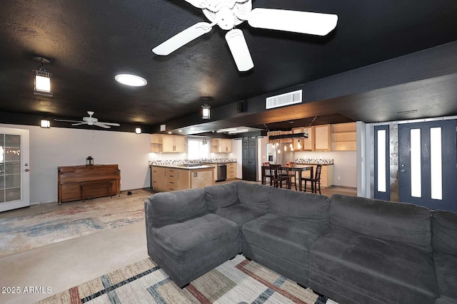 5634 N 39th Ave, Phoenix, AZ 85019 - living area with visible vents, concrete floors, and ceiling fan