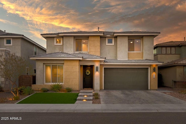 prairie-style home featuring a garage