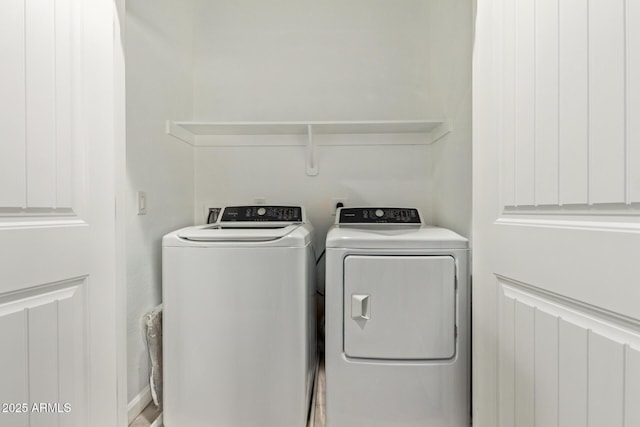 clothes washing area with laundry area and washing machine and dryer