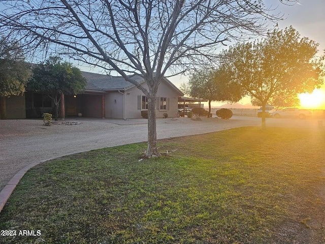 view of yard at dusk