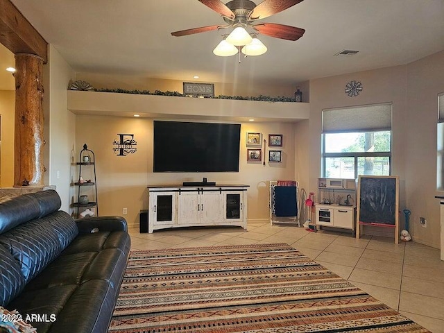 tiled living room featuring ceiling fan