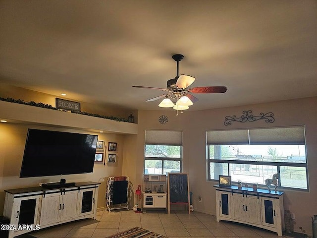 living room featuring ceiling fan and light tile patterned flooring