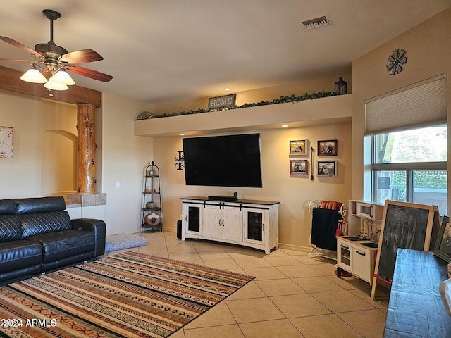 living room with ceiling fan and light tile patterned flooring