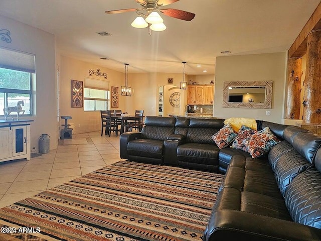 living room featuring ceiling fan and light tile patterned floors