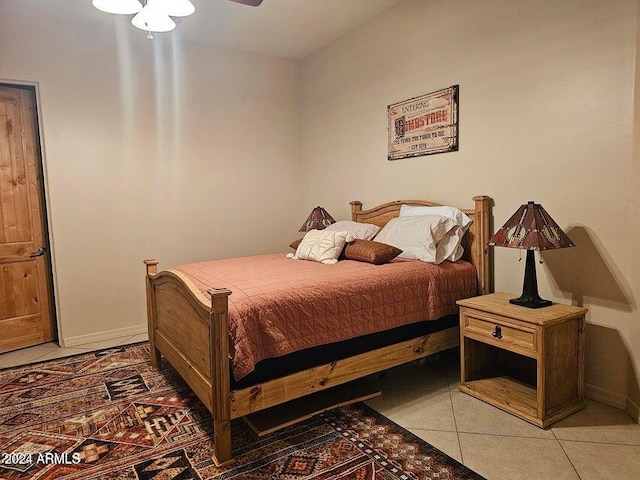 bedroom with tile patterned floors and ceiling fan