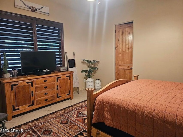 bedroom featuring light tile patterned flooring