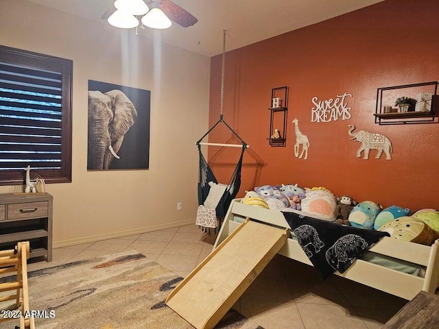 miscellaneous room featuring ceiling fan and light tile patterned flooring