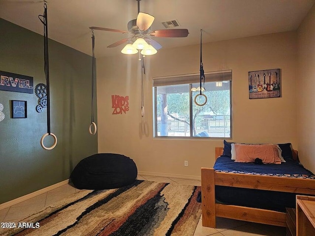 bedroom with ceiling fan and light tile patterned flooring