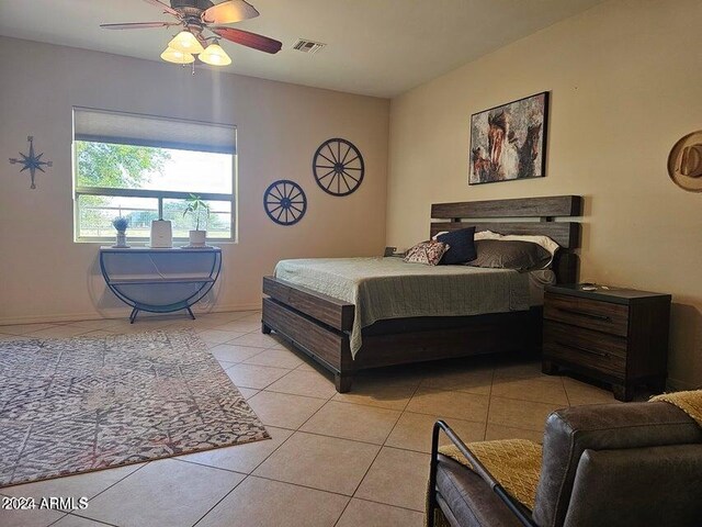 tiled bedroom with ceiling fan