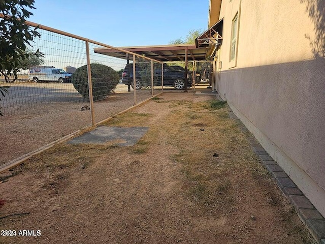 view of yard with a carport