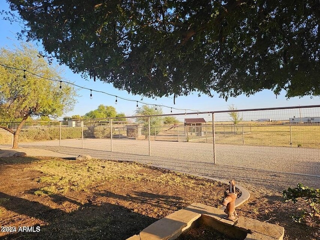 view of yard with a rural view