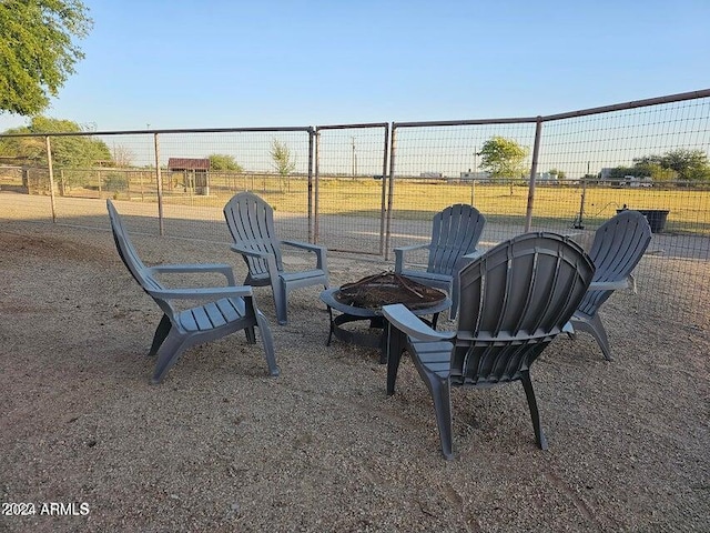 view of patio with an outdoor fire pit